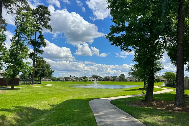 a view of a golf course with a lake