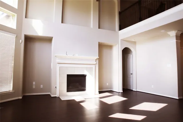 a view of an empty room with glass door