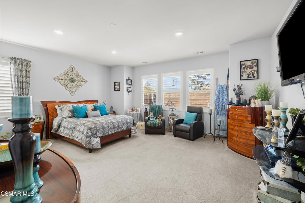 417 White Bark Lane Simi Valley, CA 93065 - Photo 15 of 30 a bedroom with furniture and a flat screen tv