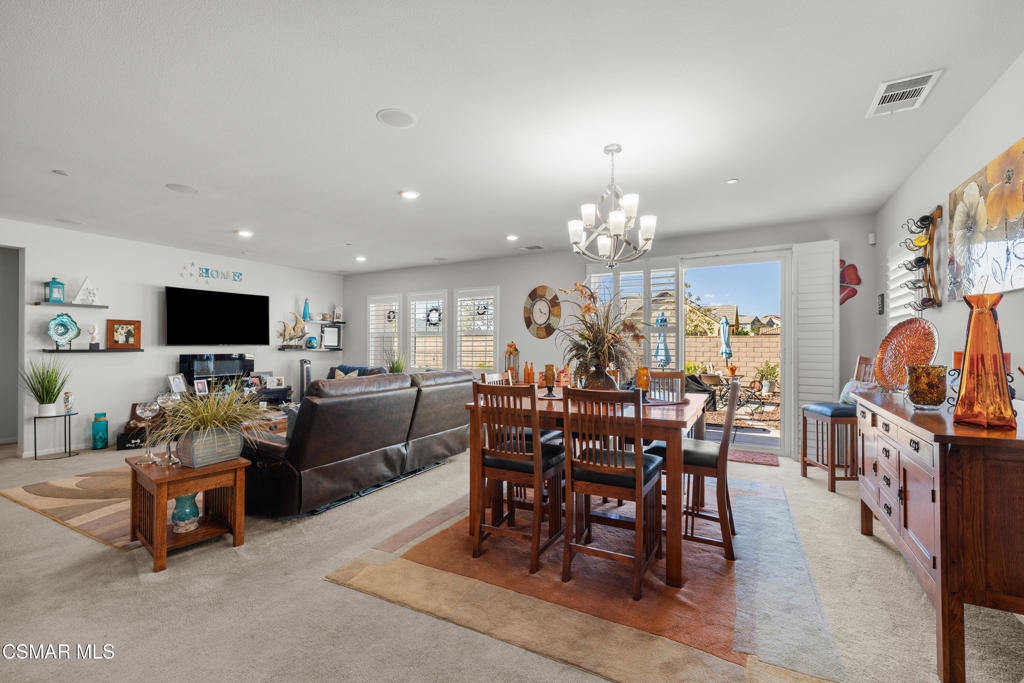 417 White Bark Lane Simi Valley, CA 93065 - Photo 9 of 30 a view of a dining room with furniture and chandelier
