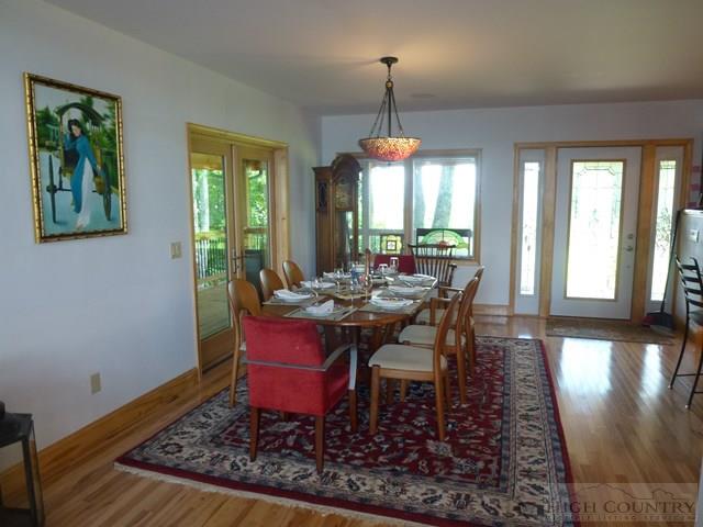 775 Miners Ridge Trail Banner Elk, NC 28604 - Photo 12 of 41 a view of a dining room with furniture window and wooden floor