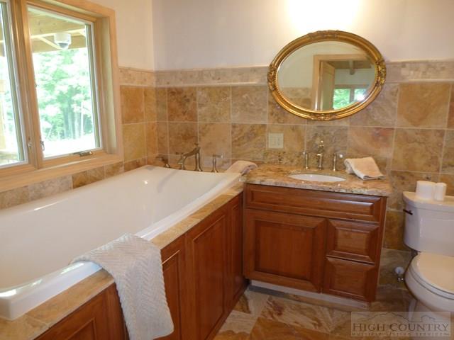 775 Miners Ridge Trail Banner Elk, NC 28604 - Photo 26 of 41 a bathroom with a sink and a toilet