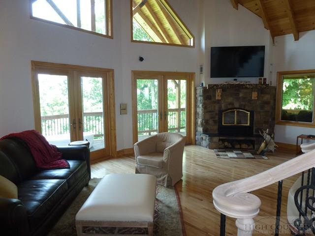 775 Miners Ridge Trail Banner Elk, NC 28604 - Photo 9 of 41 a living room with furniture a fireplace and a flat screen tv