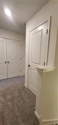 a bathroom with a double vanity sink toilet and a mirror