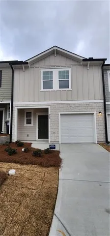 a front view of a house with stairs