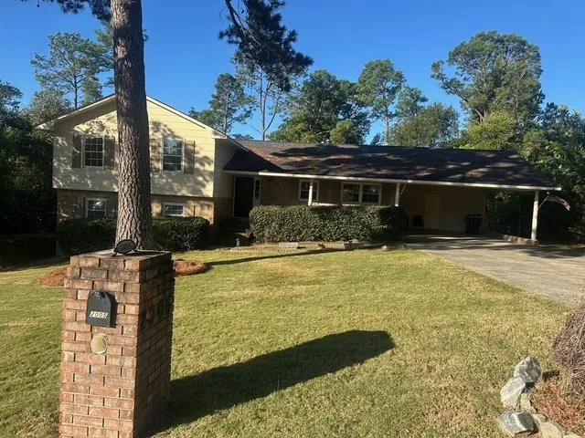 a view of house with outdoor space
