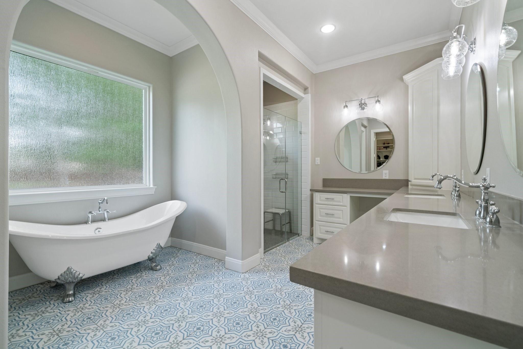 28526 Riverside Crest Lane Houston, TX 77336 - Photo 12 of 36 a spacious bathroom with a double vanity sink a mirror and a bathtub