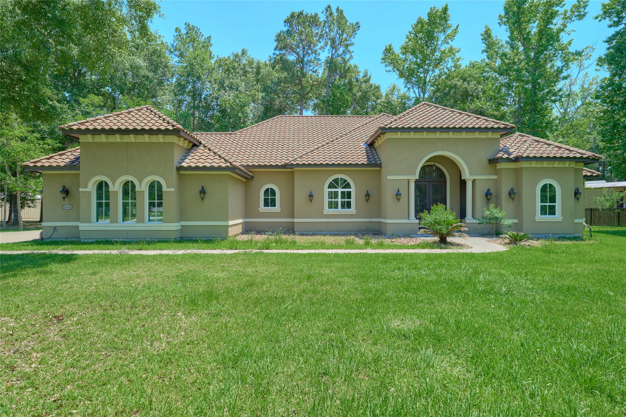 28526 Riverside Crest Lane Houston, TX 77336 - Photo 2 of 36 a front view of a house with a garden