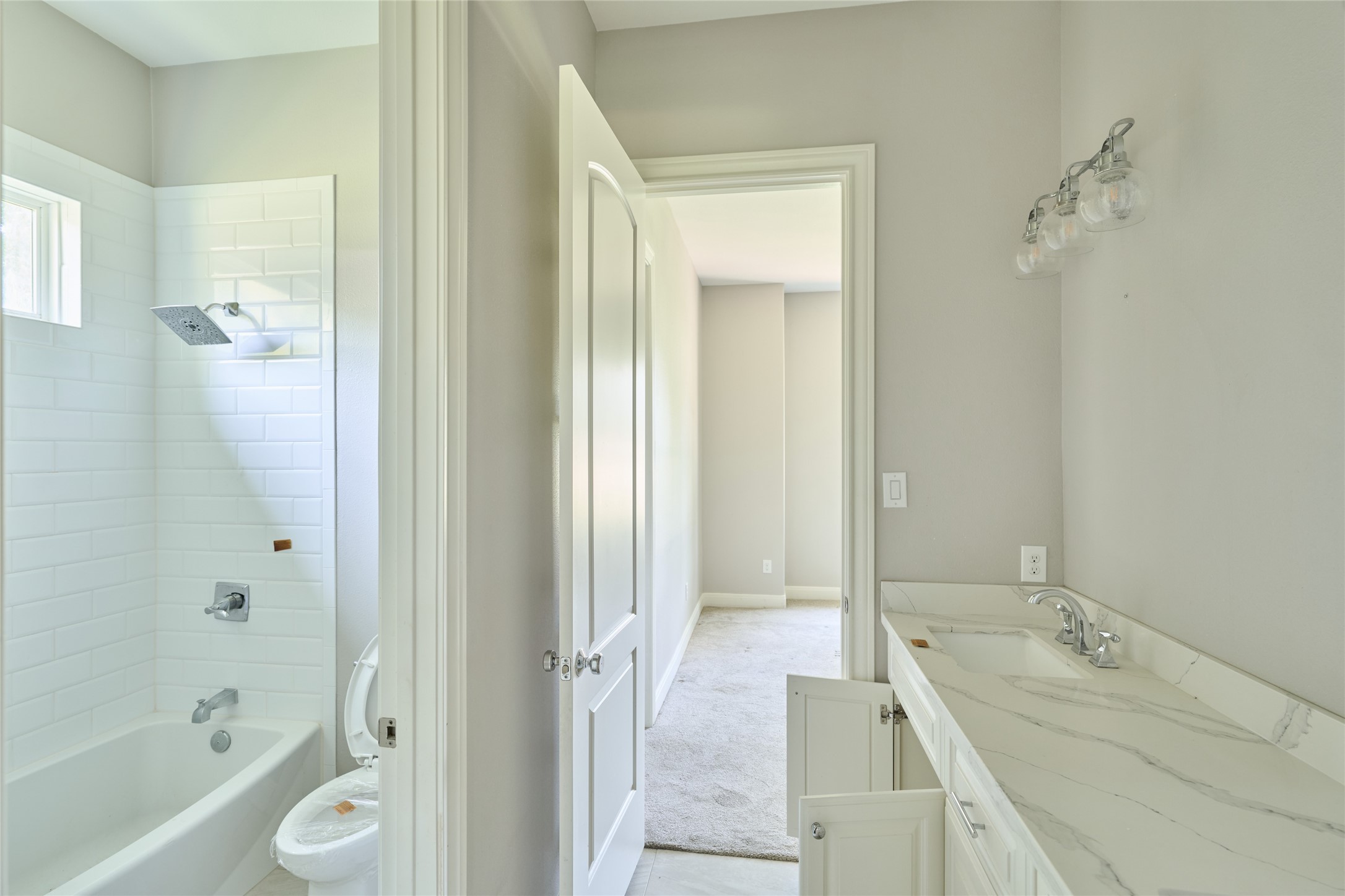 28526 Riverside Crest Lane Houston, TX 77336 - Photo 22 of 36 a bathroom with a granite countertop tub sink and mirror