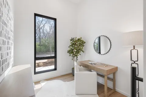 a view of a livingroom with furniture and windows