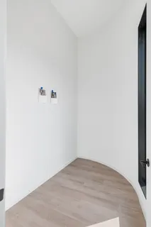 a view of utility room with wooden floor