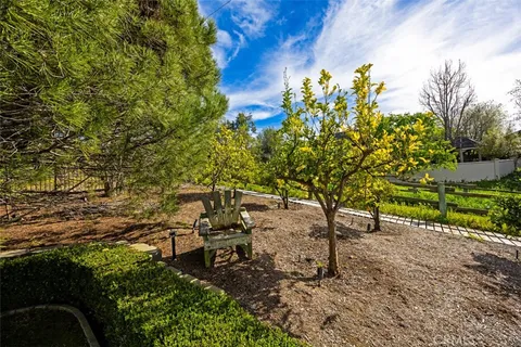 a view of a garden with outdoor seating