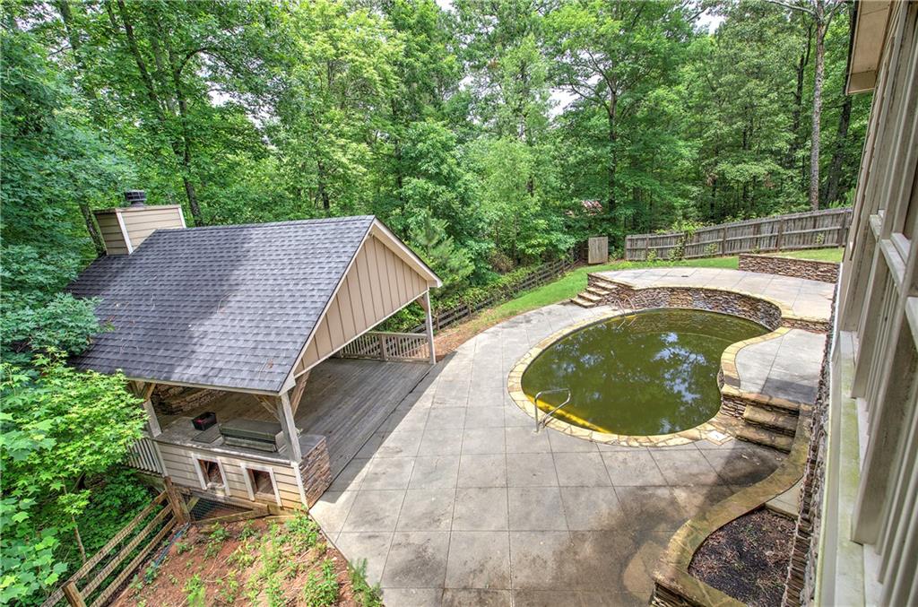 561 Holland Road Dallas, GA 30157 - Photo 18 of 48 a view of balcony with swimming pool and trees in the background