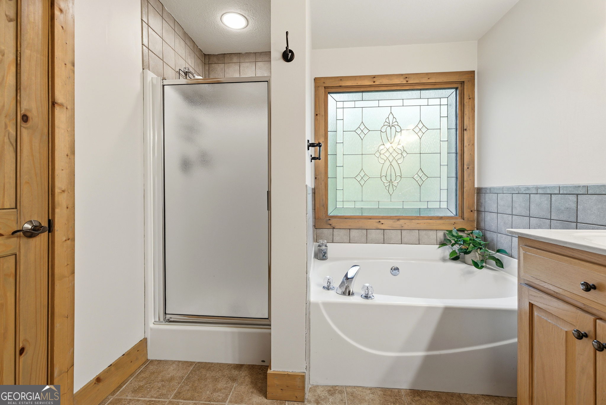 634 Little Hawk Road Sautee Nacoochee, GA 30571 - Photo 20 of 54 a bathroom with a tub and shower