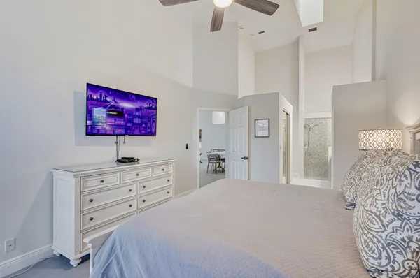 a bedroom with a bed and a dresser