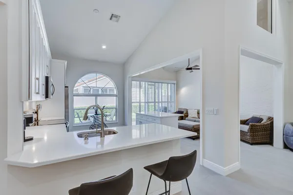 a kitchen with a sink and a refrigerator