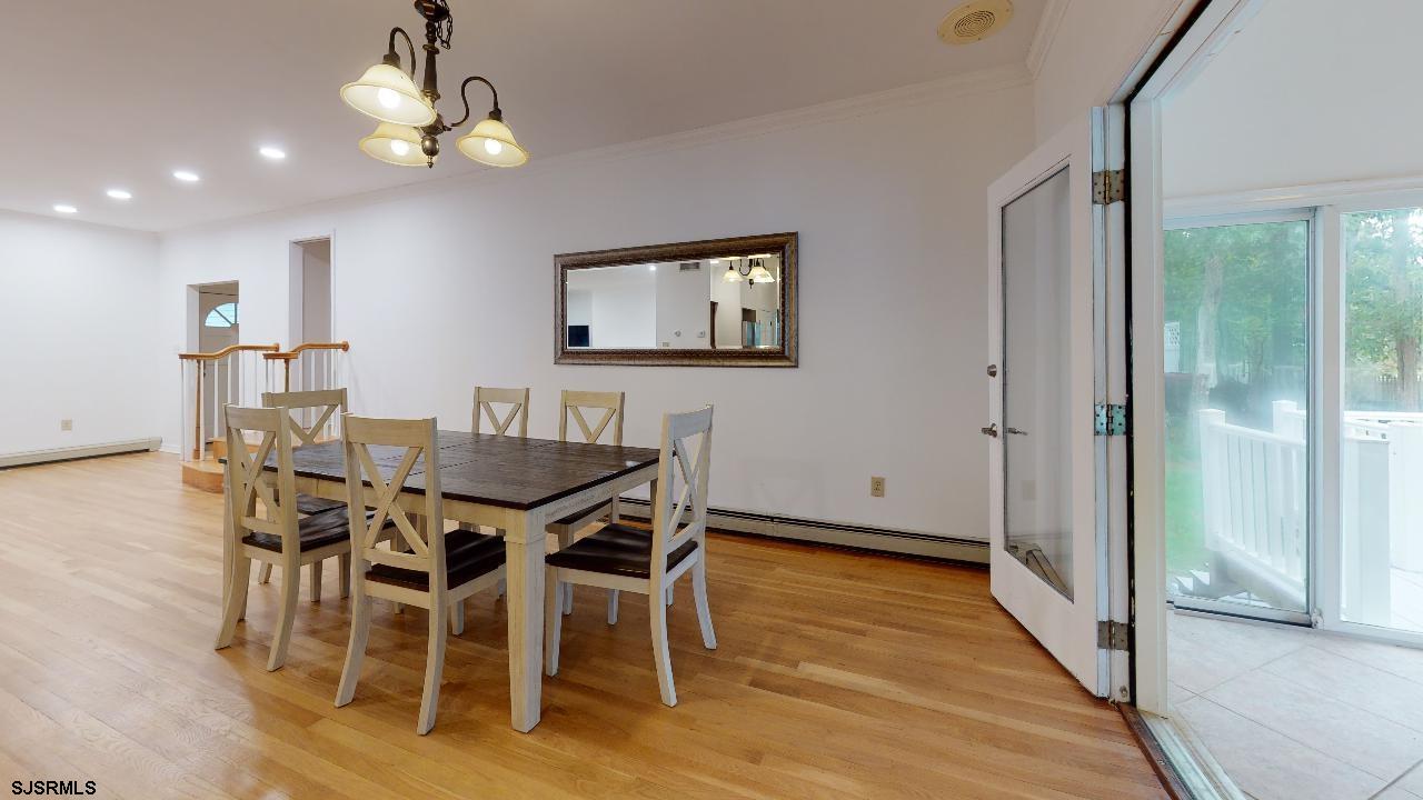 9 Edward Terrace Ocean View, NJ 08230 - Photo 11 of 30 a view of a dining room with furniture and chandelier
