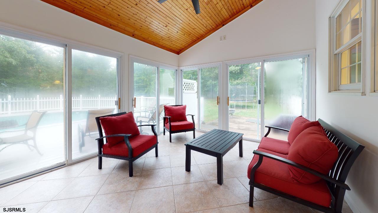 9 Edward Terrace Ocean View, NJ 08230 - Photo 13 of 30 a living room with furniture and a floor to ceiling window