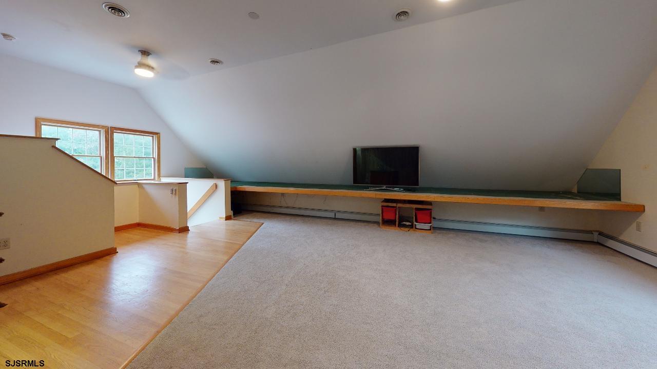 9 Edward Terrace Ocean View, NJ 08230 - Photo 16 of 30 a backyard of a house with wooden floor and couch