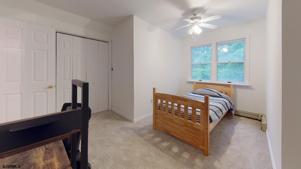 9 Edward Terrace Ocean View, NJ 08230 - Photo 19 of 30 a bedroom with a bed and a window