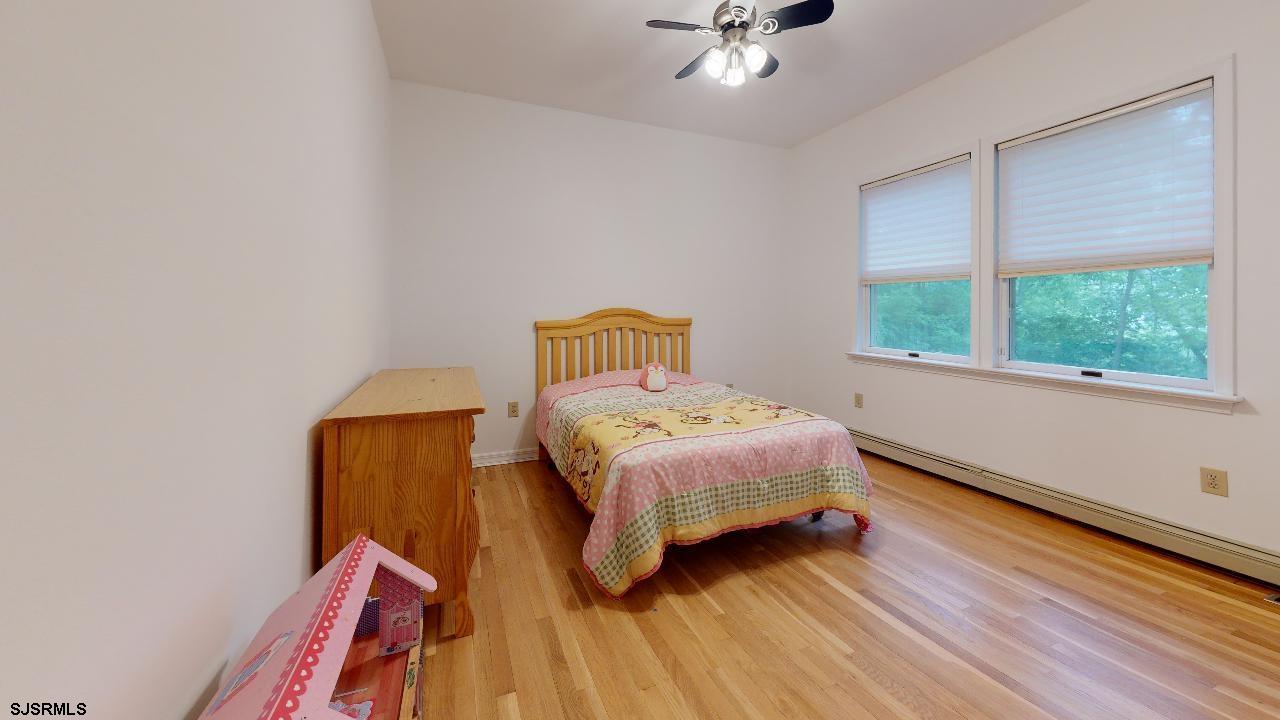 9 Edward Terrace Ocean View, NJ 08230 - Photo 26 of 30 a bedroom with a bed and a window
