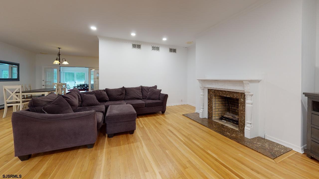 9 Edward Terrace Ocean View, NJ 08230 - Photo 7 of 30 a living room with furniture and a fireplace
