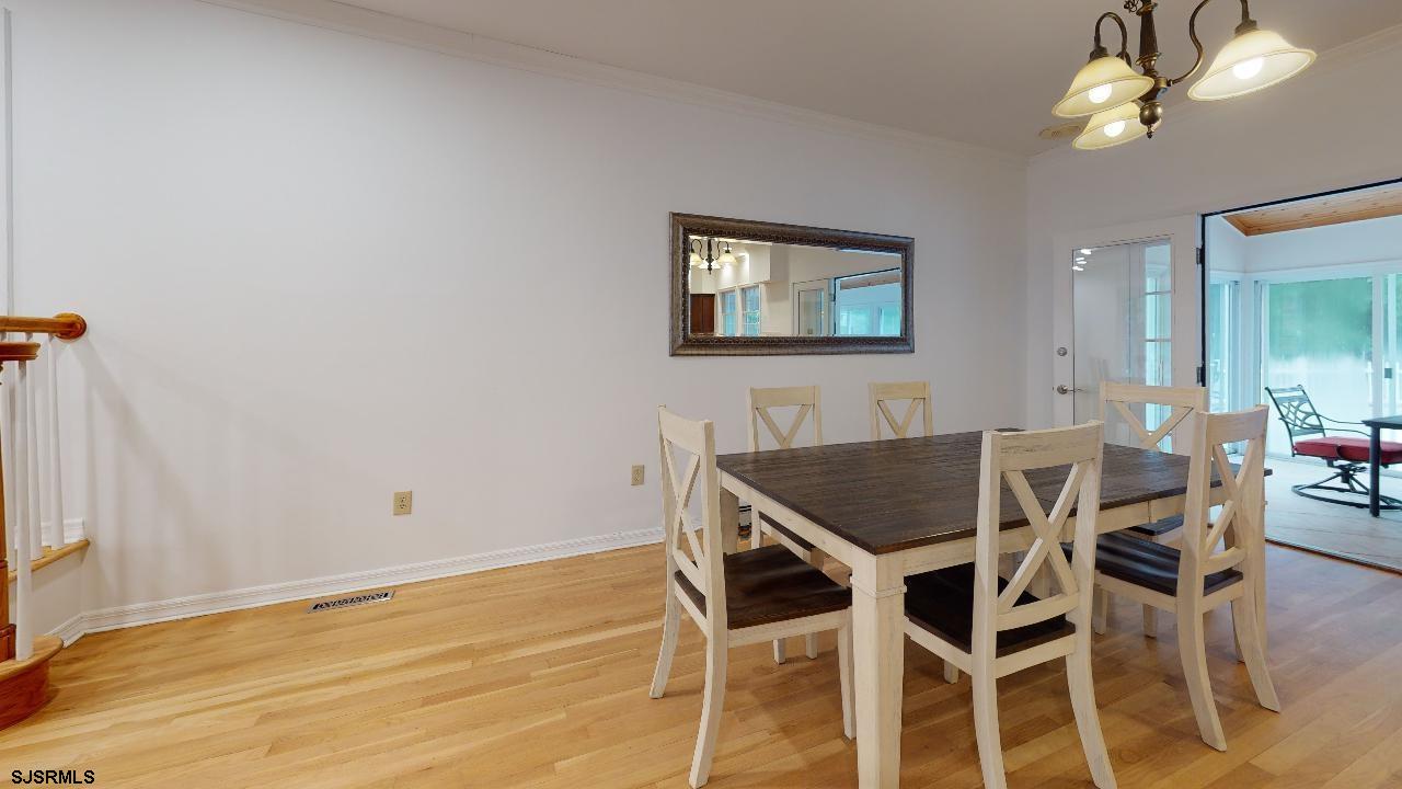 9 Edward Terrace Ocean View, NJ 08230 - Photo 10 of 30 a view of a dining room with furniture and wooden floor
