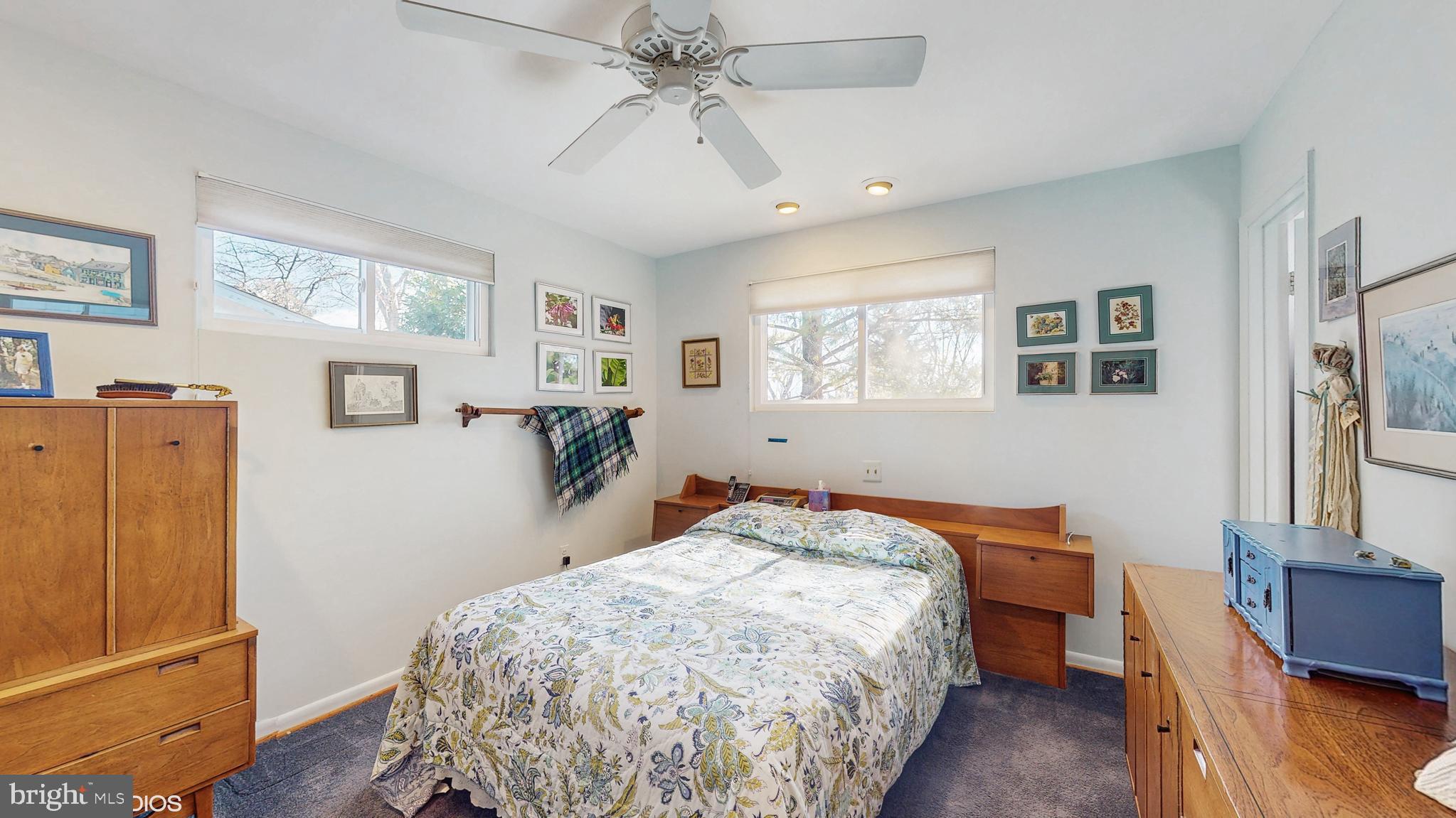 906 Malta Lane Silver Spring, MD 20901 - Photo 11 of 35 a bedroom with a bed and wooden floor