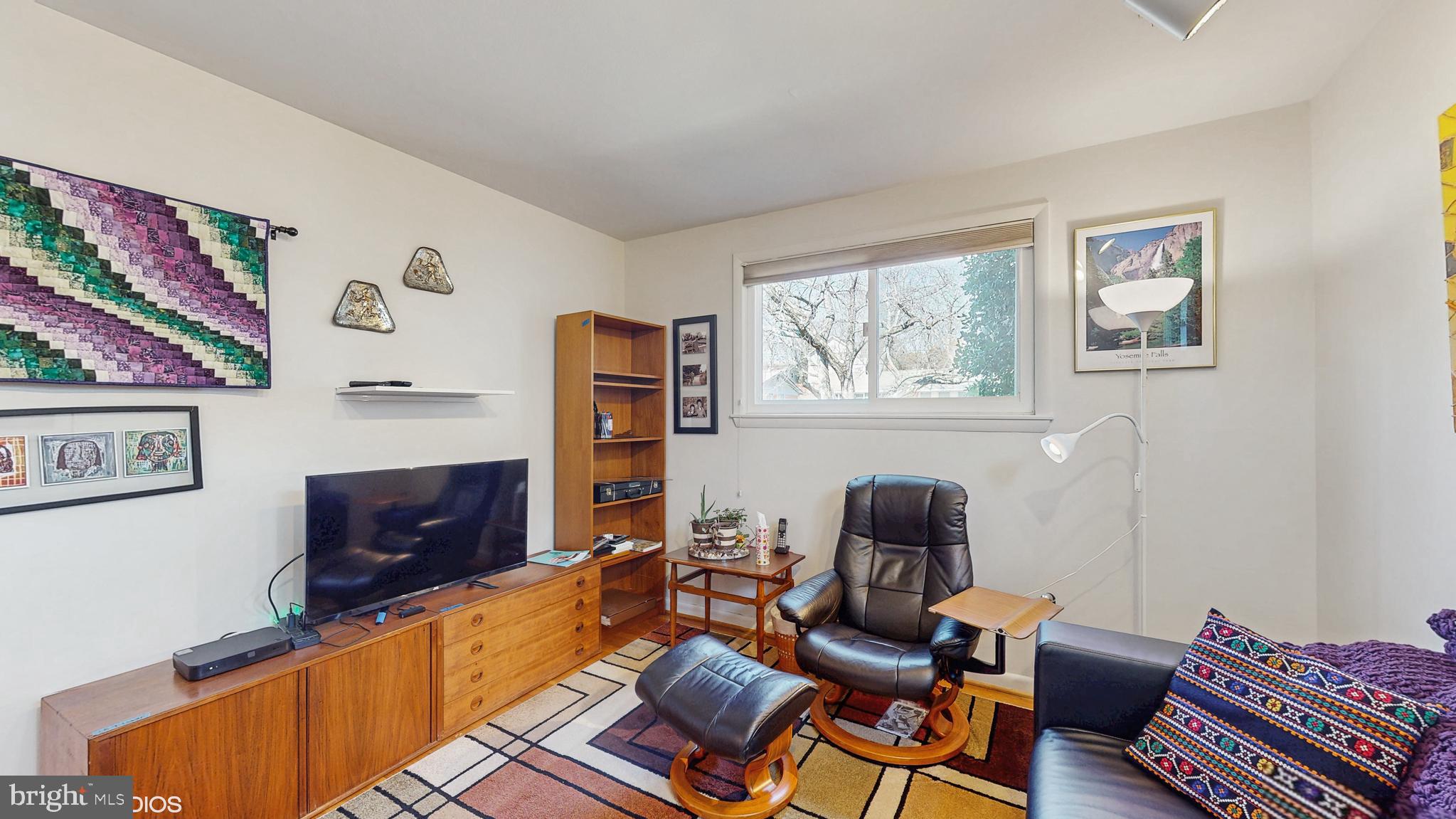 906 Malta Lane Silver Spring, MD 20901 - Photo 16 of 35 a room with furniture and a window