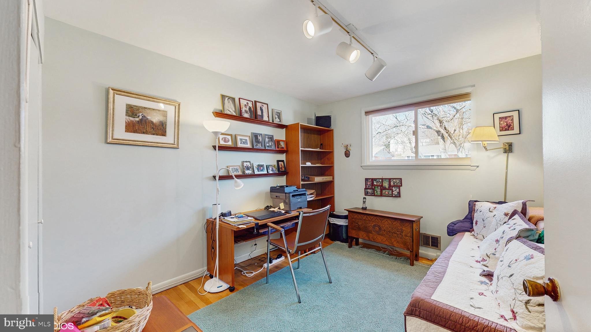 906 Malta Lane Silver Spring, MD 20901 - Photo 17 of 35 a bedroom with furniture and a window
