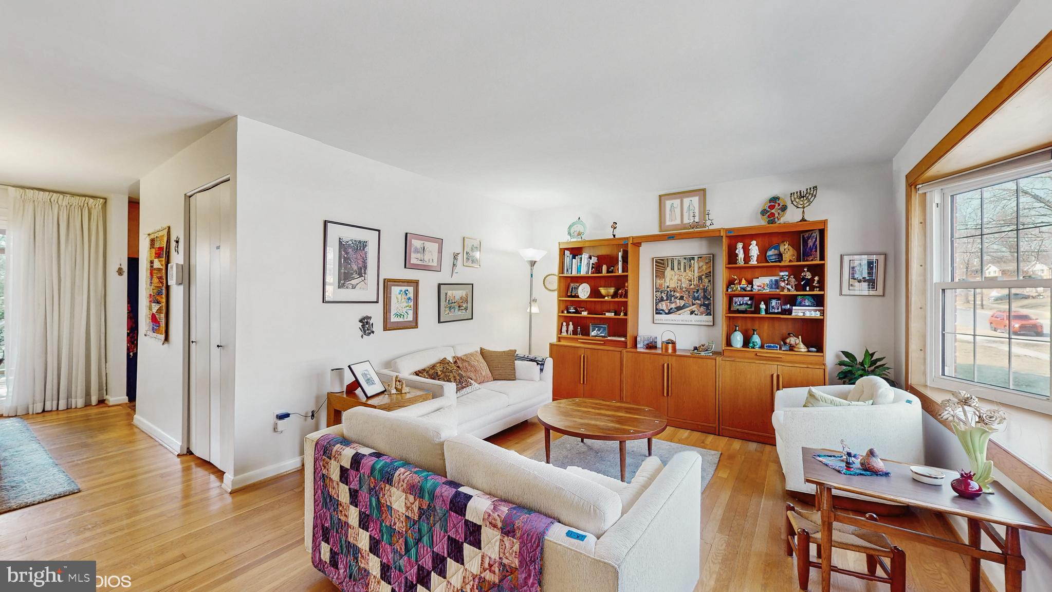 906 Malta Lane Silver Spring, MD 20901 - Photo 2 of 35 a living room with furniture a bookshelf and a window