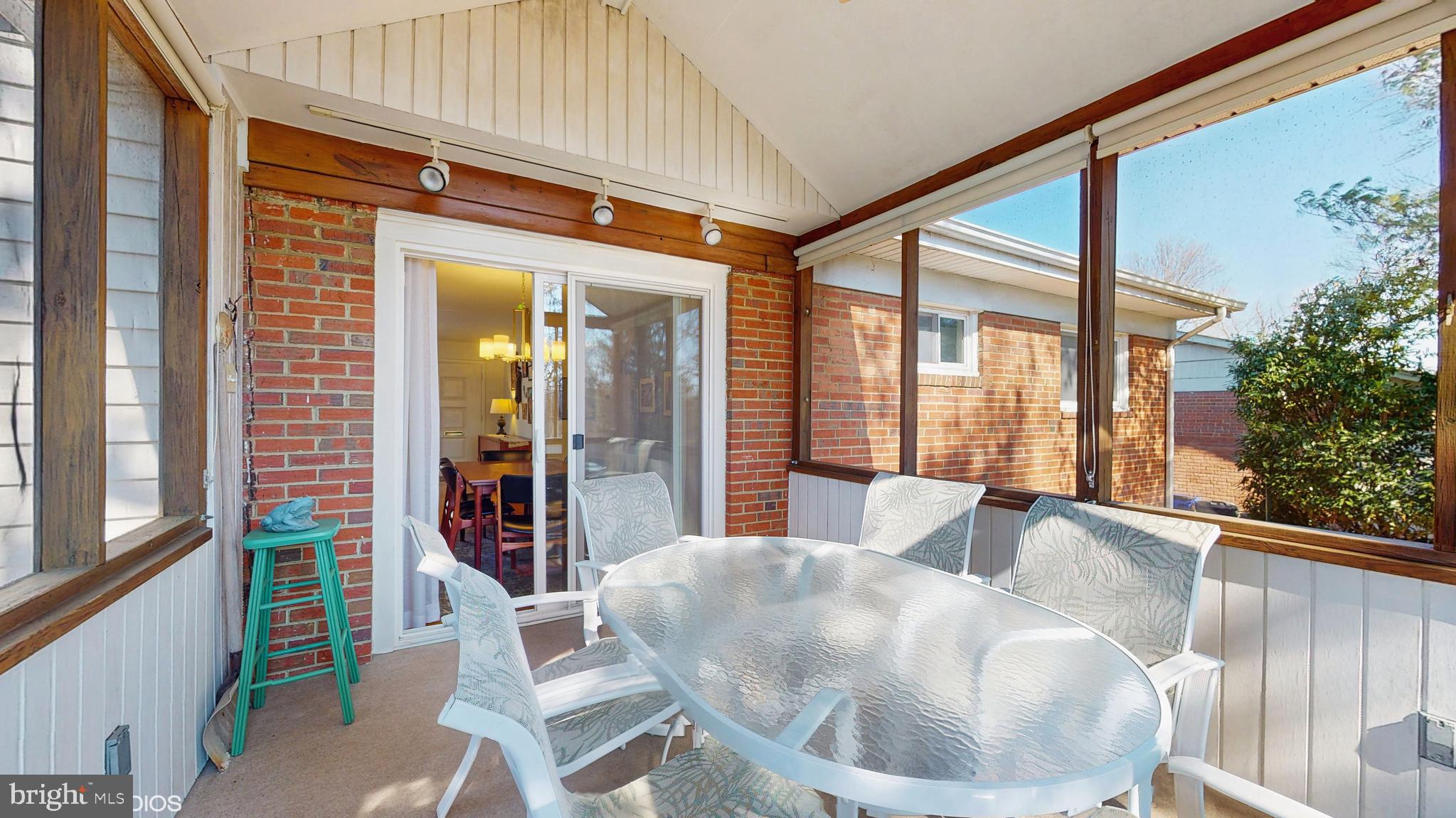 906 Malta Lane Silver Spring, MD 20901 - Photo 21 of 35 a living room with furniture and a large window