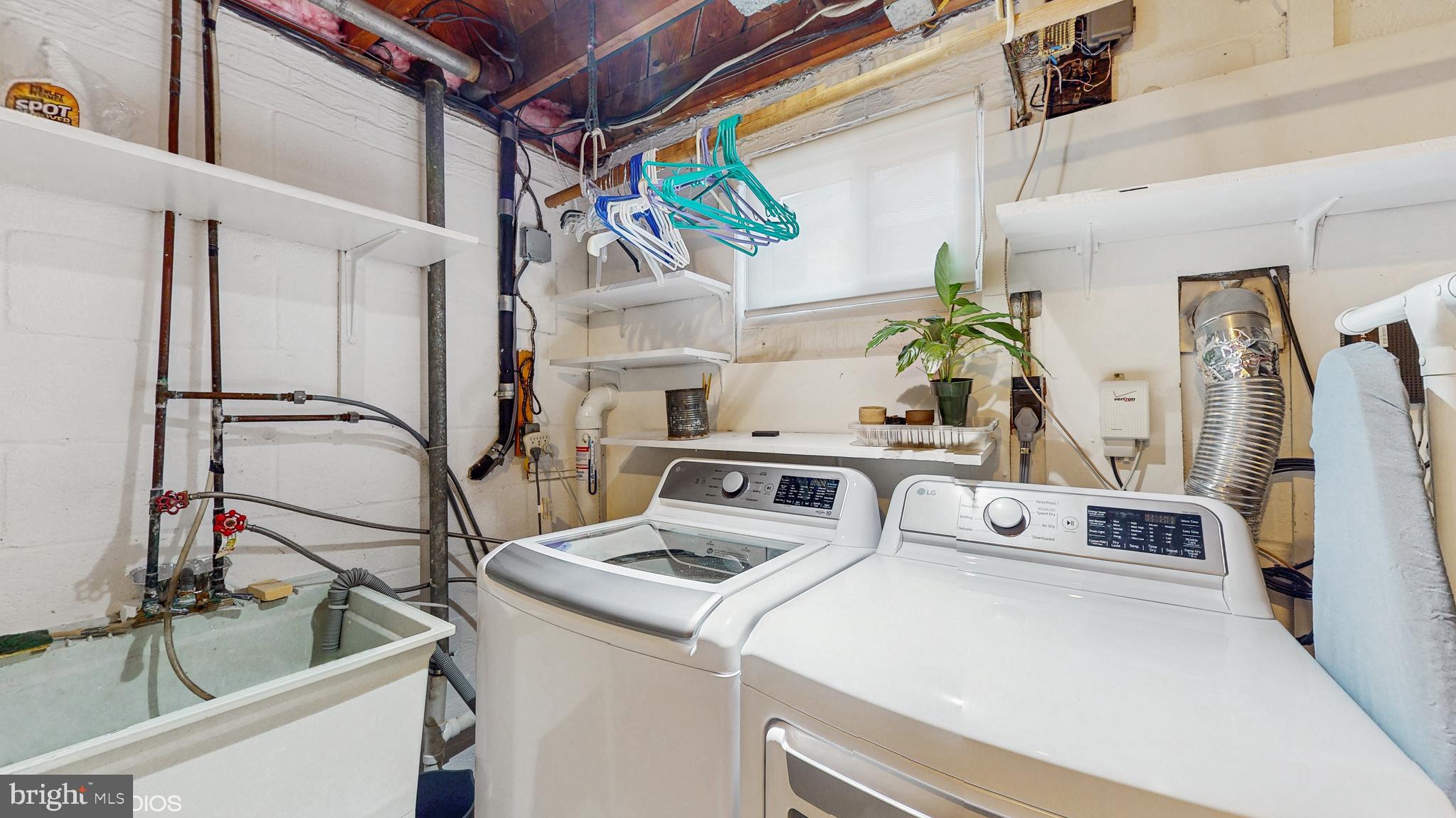 906 Malta Lane Silver Spring, MD 20901 - Photo 27 of 35 a utility room with dryer and washer