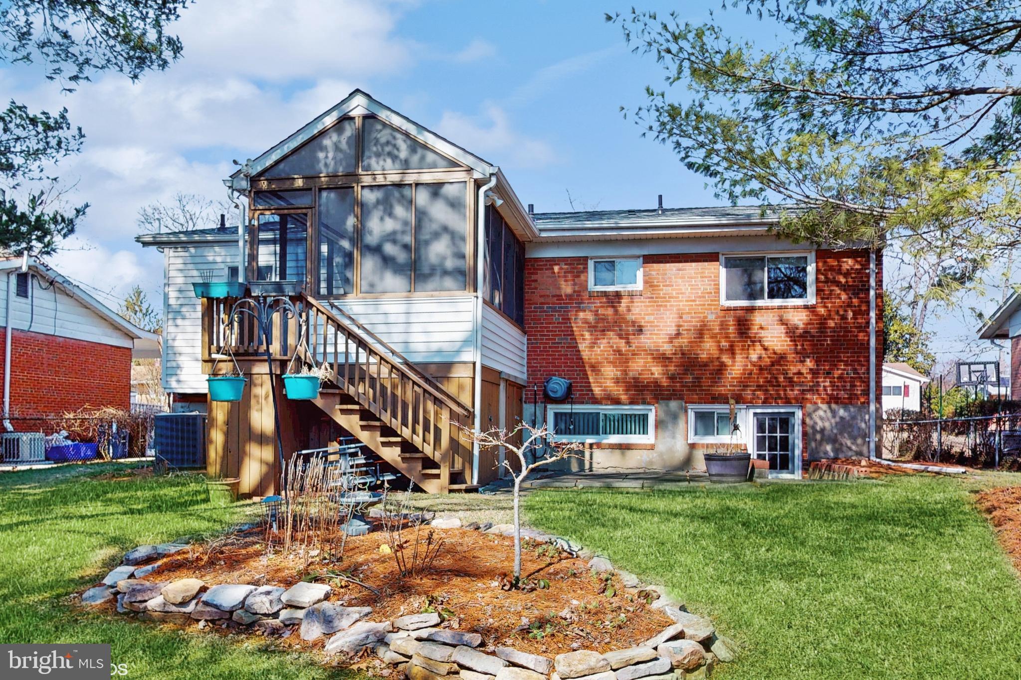 906 Malta Lane Silver Spring, MD 20901 - Photo 29 of 35 a front view of a house with a yard