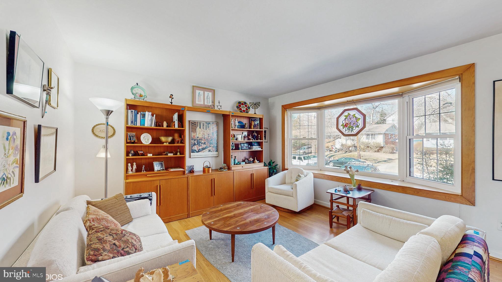 906 Malta Lane Silver Spring, MD 20901 - Photo 4 of 35 a living room with furniture and a large window