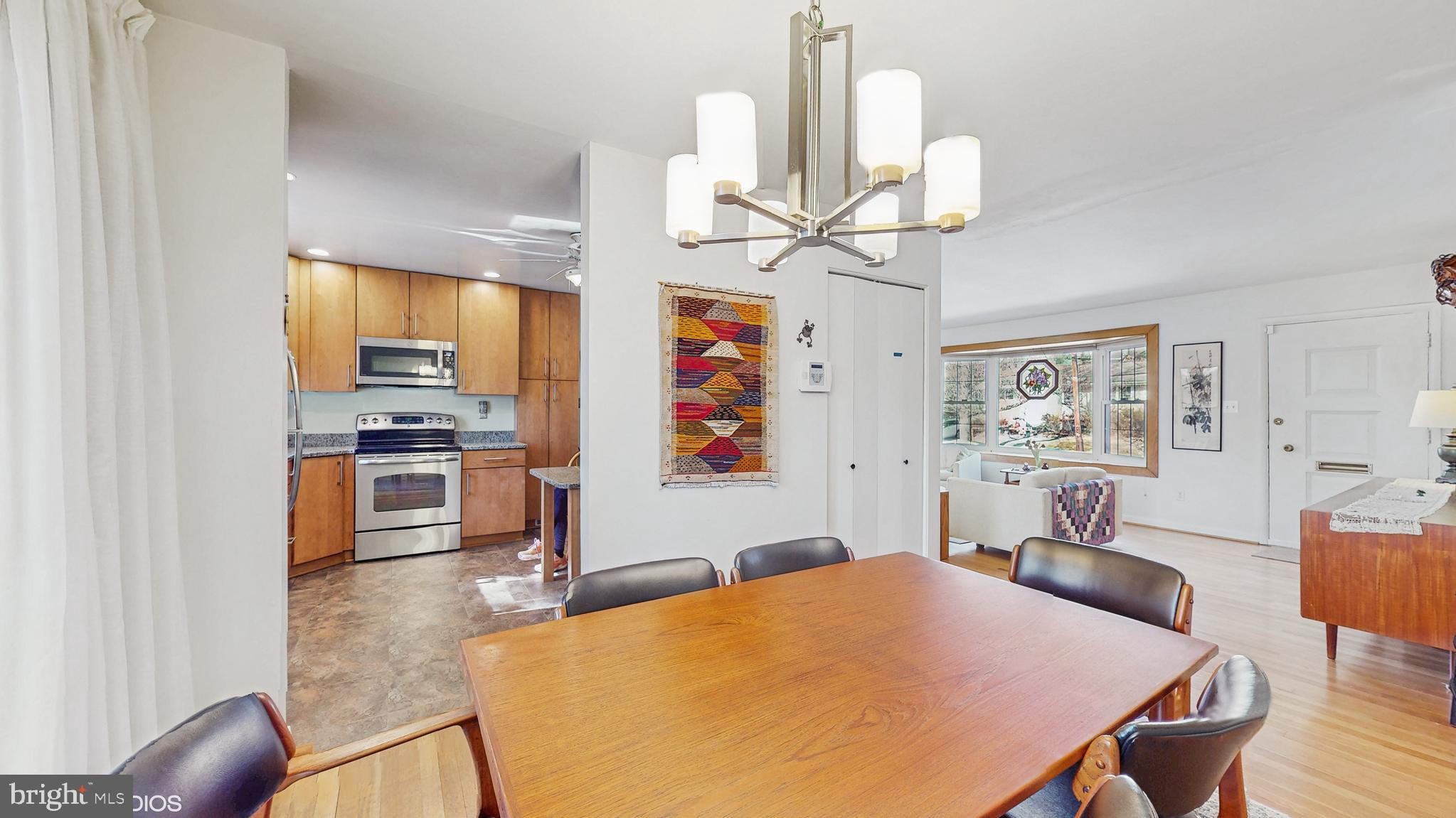 906 Malta Lane Silver Spring, MD 20901 - Photo 6 of 35 a view of a dining room with furniture wooden floor and chandelier