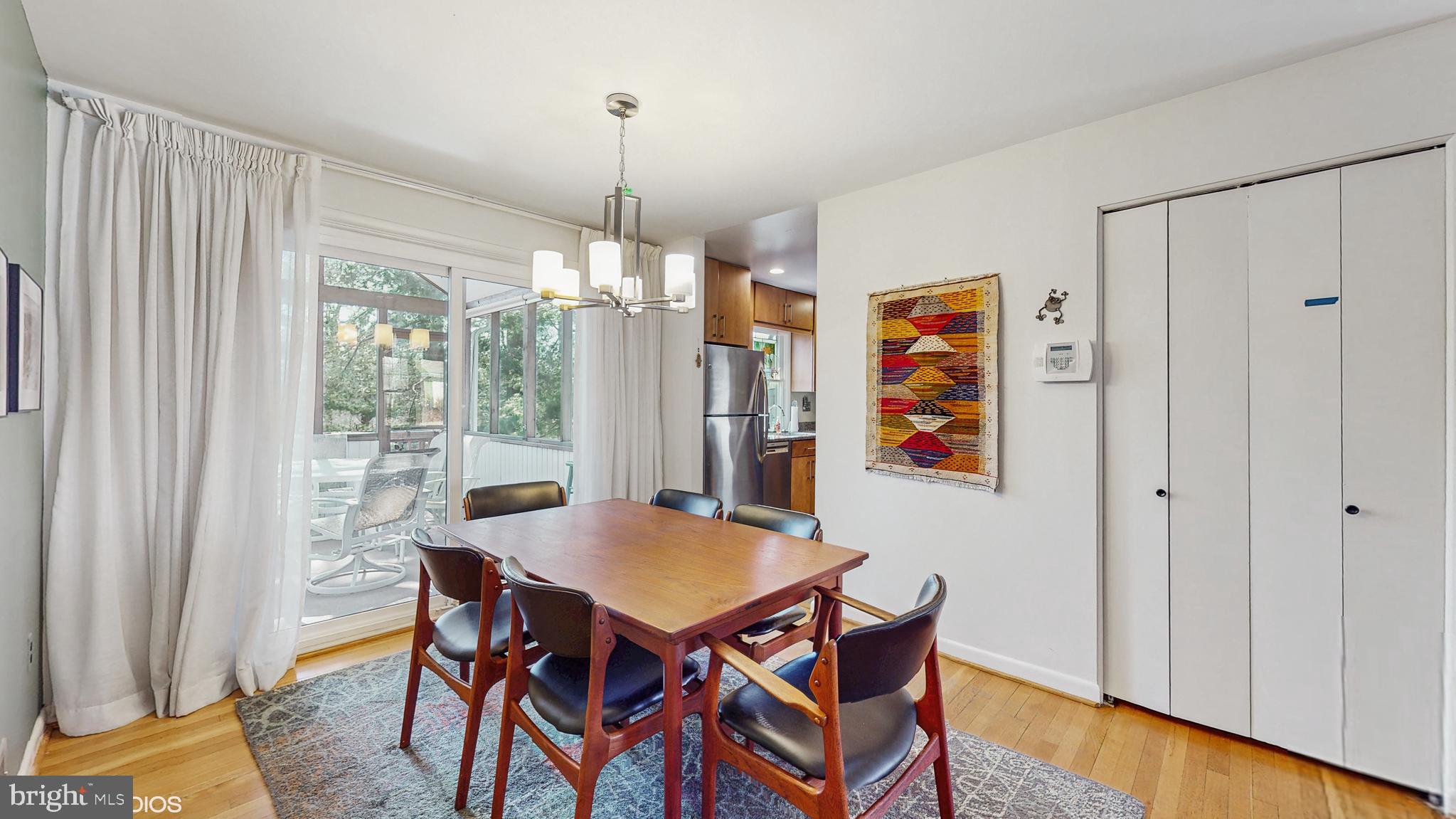 906 Malta Lane Silver Spring, MD 20901 - Photo 7 of 35 a view of a dining room with furniture window and wooden floor