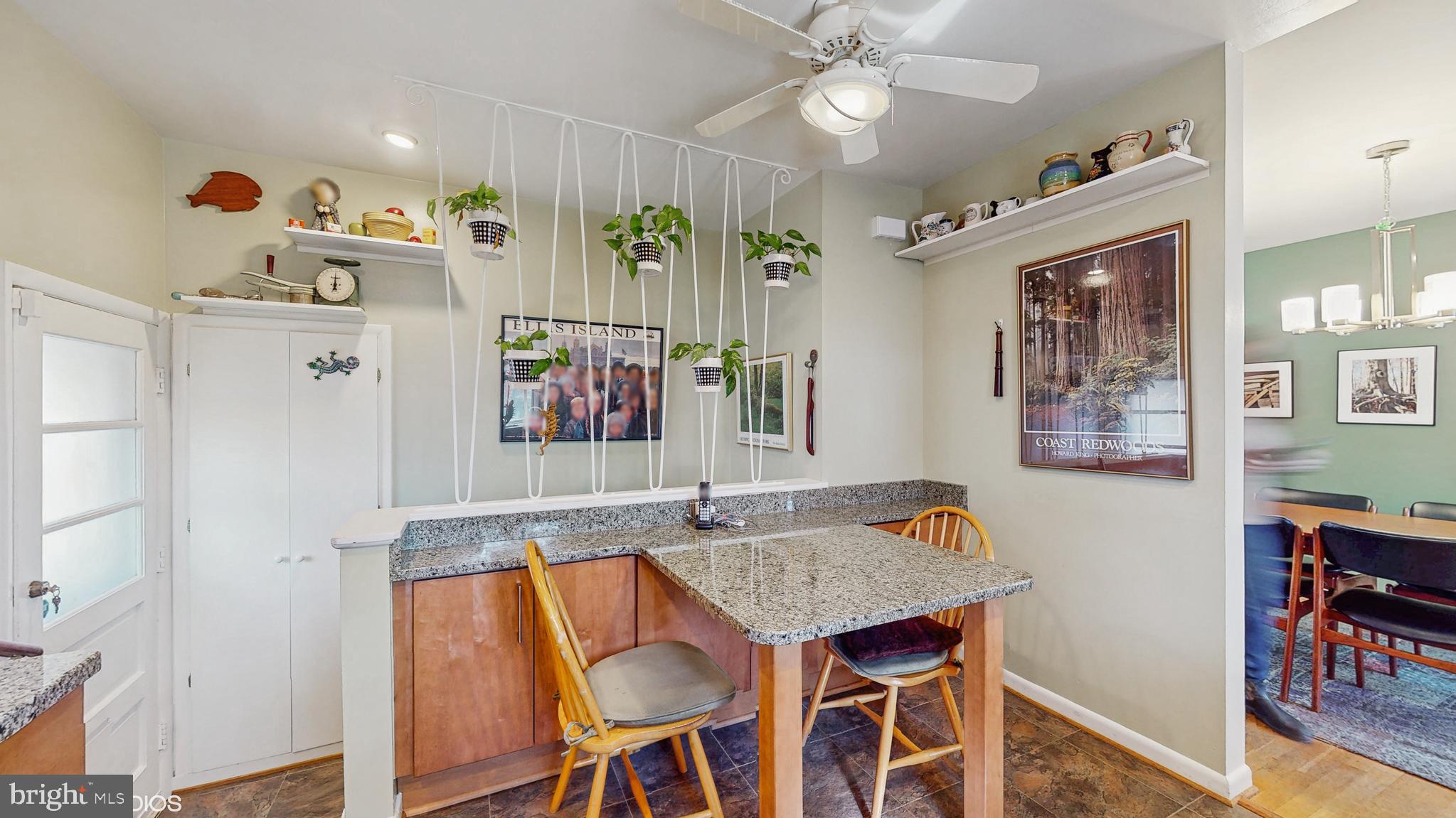 906 Malta Lane Silver Spring, MD 20901 - Photo 10 of 35 a view of a dining room with furniture and wooden floor
