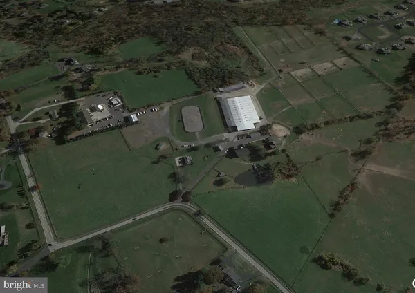 an aerial view of a house with a lake view