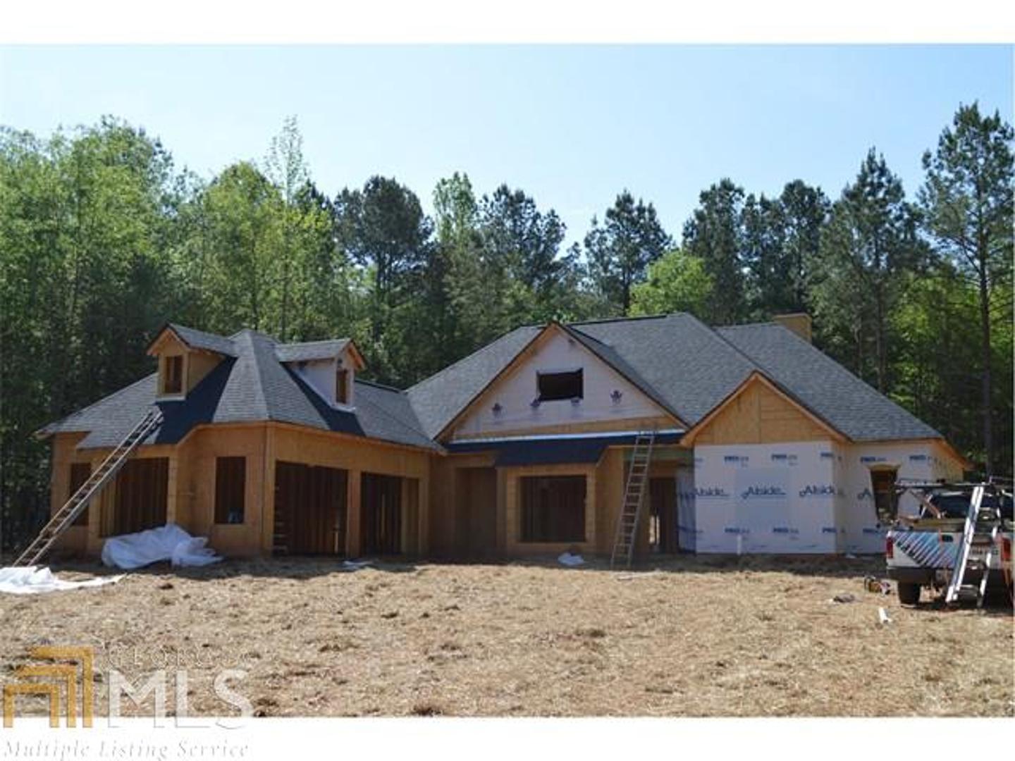 0 Ridgeview Drive, Unit 52 Newnan, GA 30263 - Photo 1 of 1 a house with trees in the background