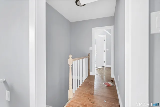 a view of a patio with table and chairs with wooden fence and floor