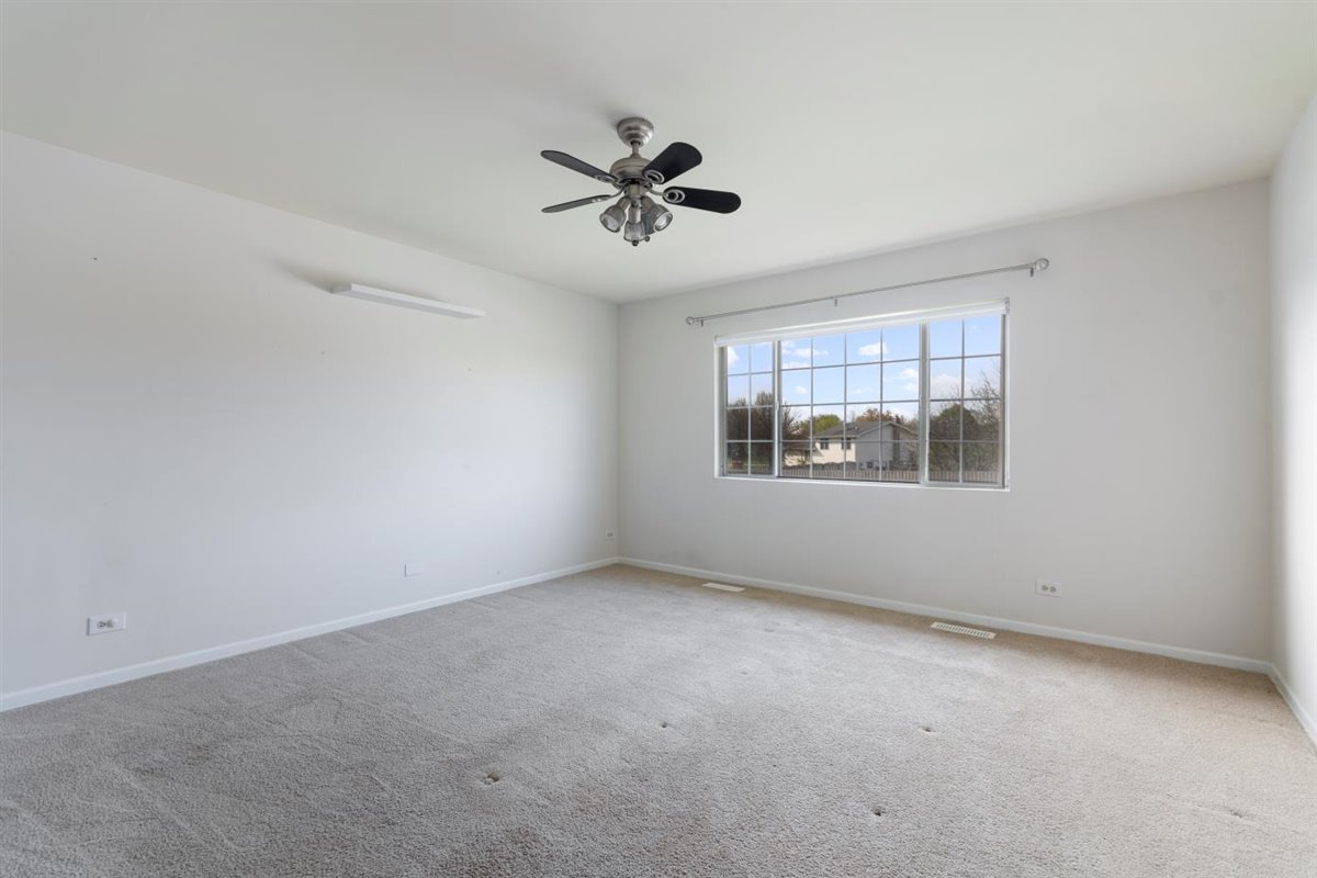 1171 Longford Road Bartlett, IL 60103 - Photo 14 of 22 a view of an empty room with a window