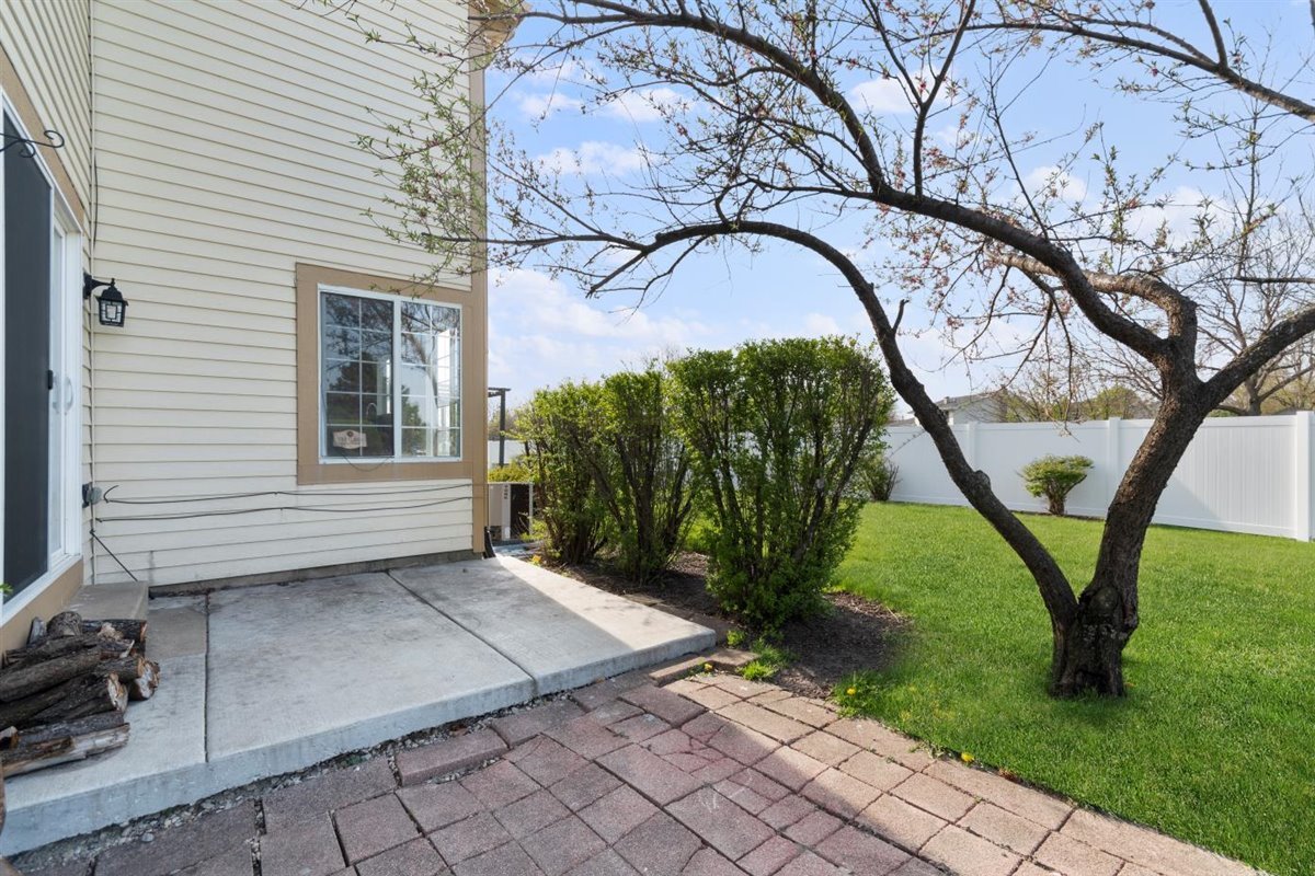 1171 Longford Road Bartlett, IL 60103 - Photo 20 of 22 a view of backyard with a garden and trees