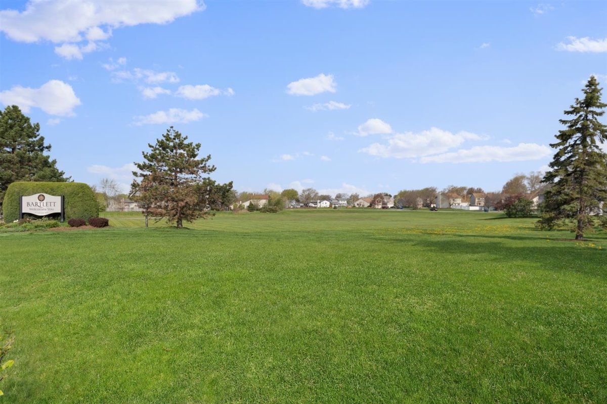 1171 Longford Road Bartlett, IL 60103 - Photo 22 of 22 a view of a green field with covered in the background