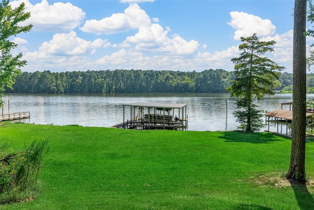 223 Razorback Lane Homer, LA 71040 - Photo 11 of 37 a view of a lake with a house in the background