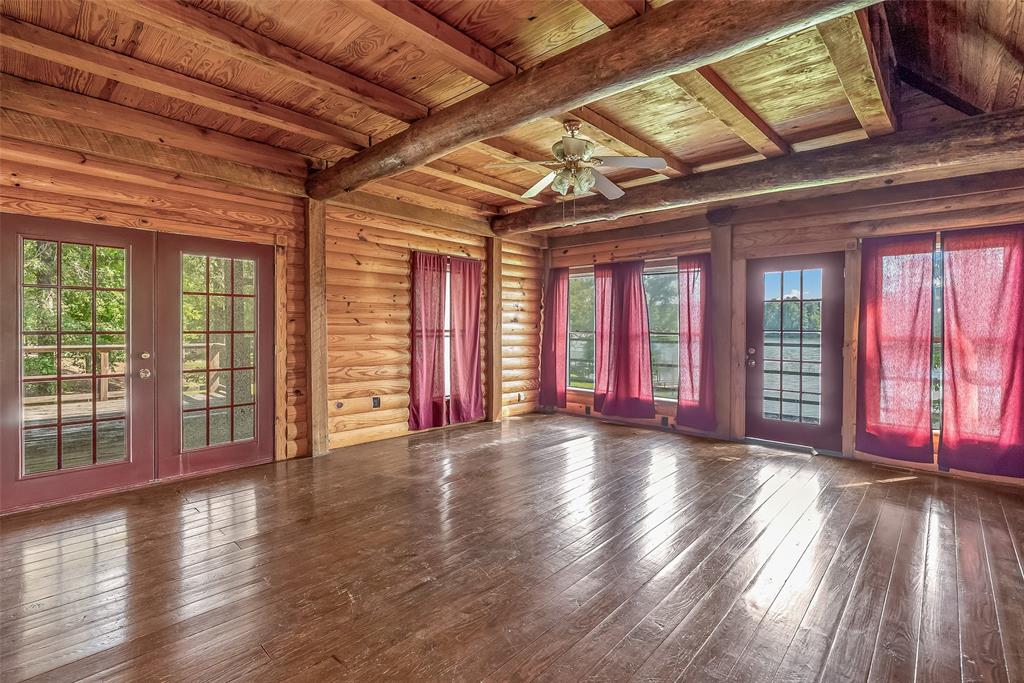 223 Razorback Lane Homer, LA 71040 - Photo 12 of 37 a view of an empty room with wooden floor and a window