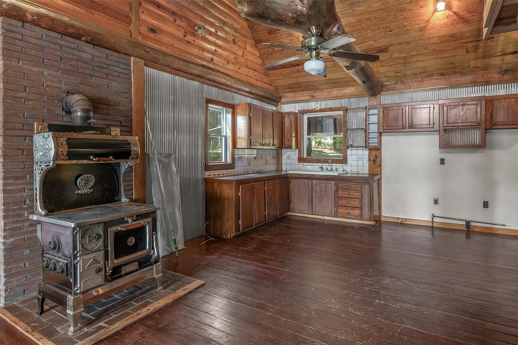 223 Razorback Lane Homer, LA 71040 - Photo 15 of 37 a view of a kitchen with a sink cabinets and a fireplace