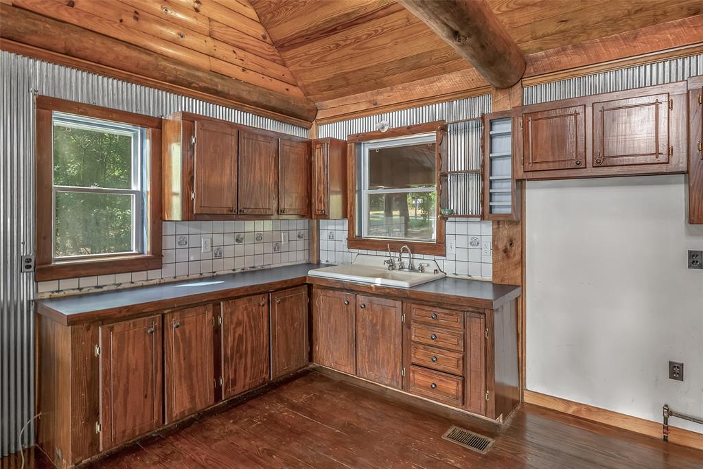 223 Razorback Lane Homer, LA 71040 - Photo 17 of 37 a kitchen with stainless steel appliances granite countertop a sink and cabinets with wooden floor