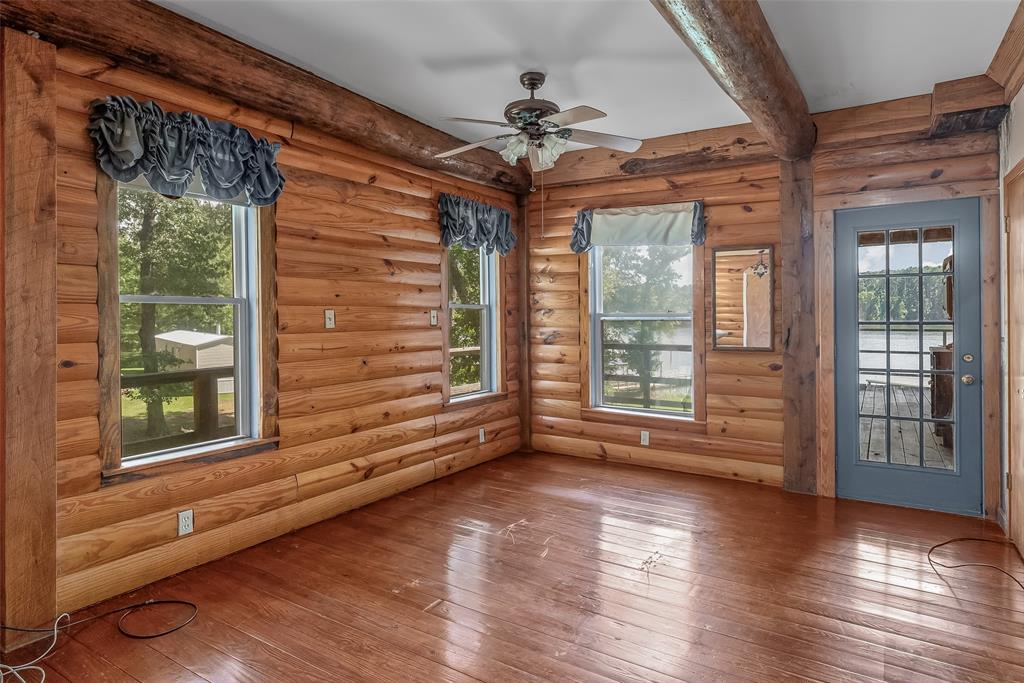 223 Razorback Lane Homer, LA 71040 - Photo 21 of 37 a view of an empty room with wooden floor and a window