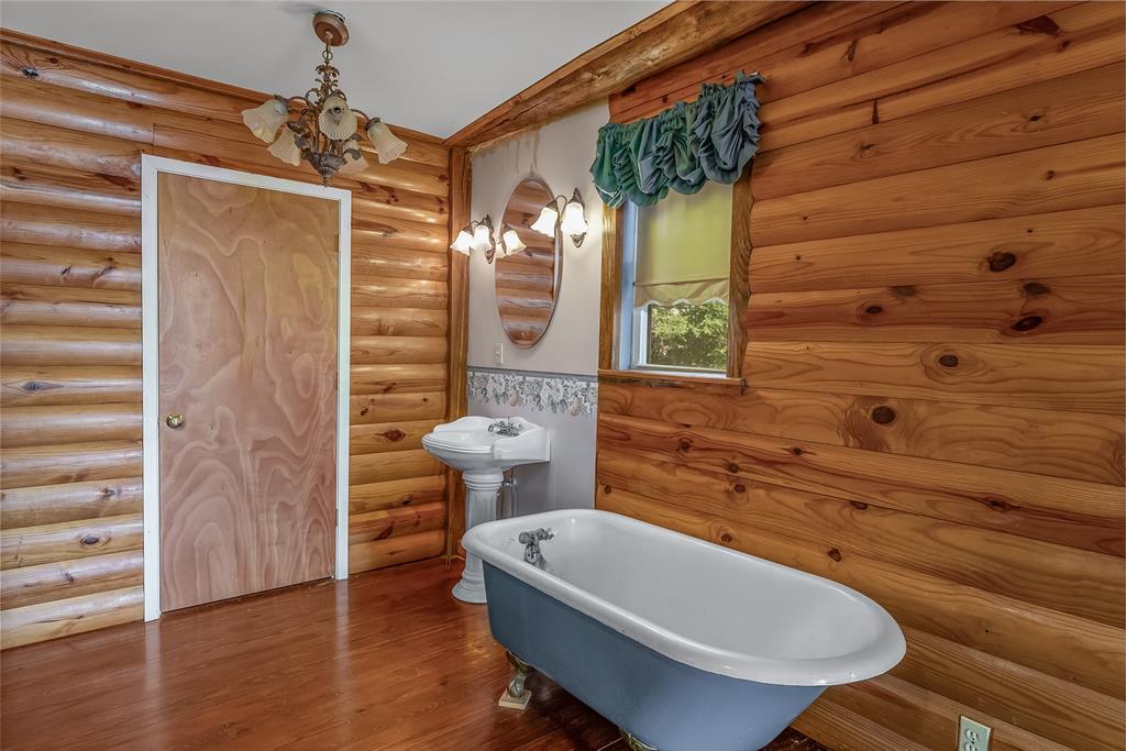 223 Razorback Lane Homer, LA 71040 - Photo 22 of 37 a bathroom with a toilet a sink and shower